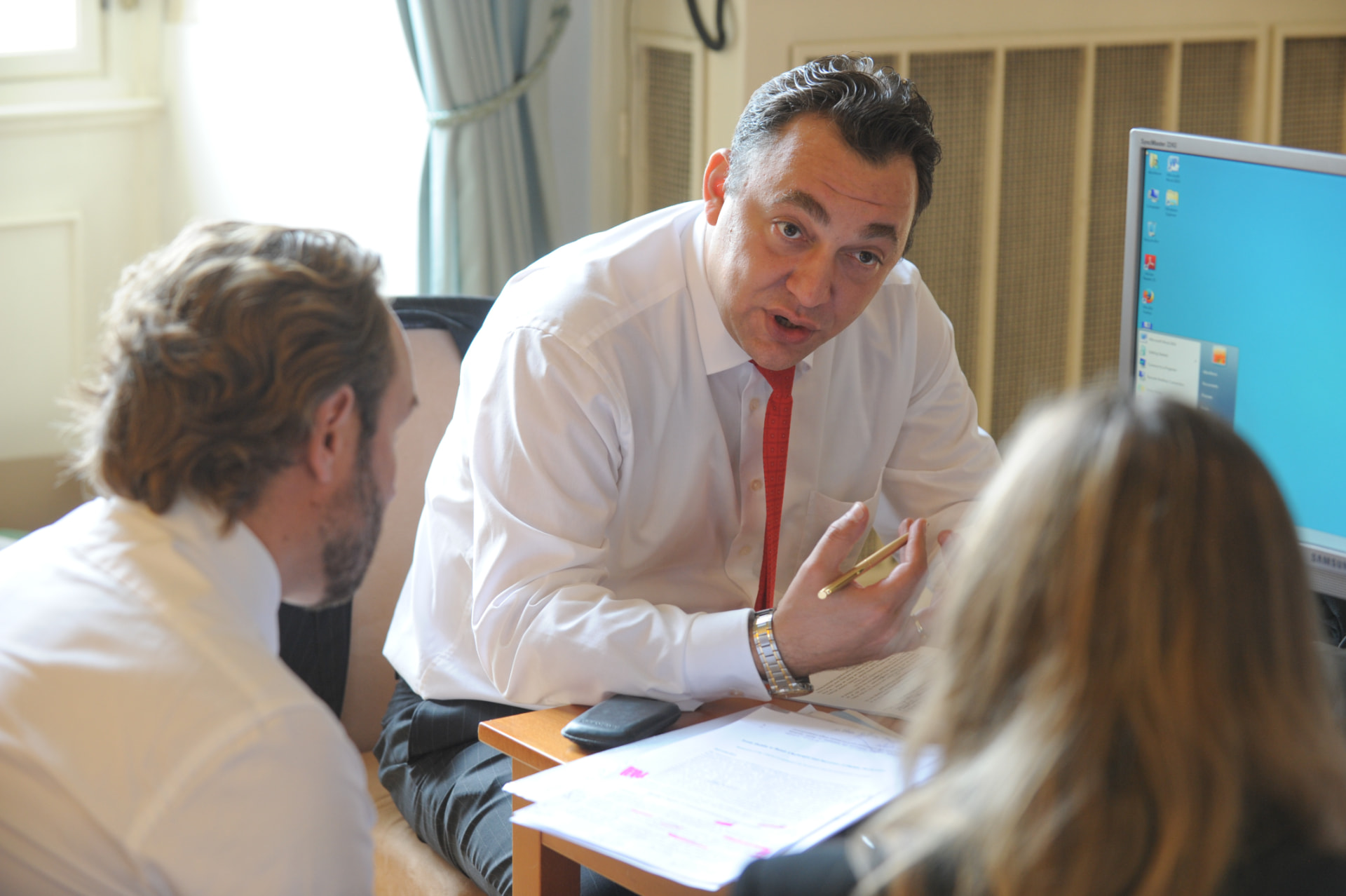 Andrei Muntean briefing colleagues during a working session